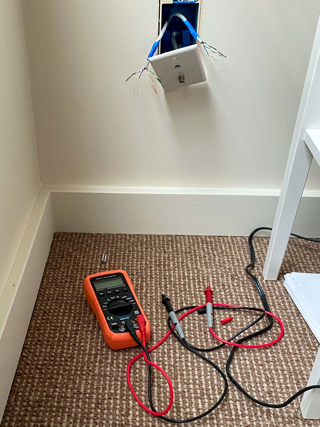 Testing wall plate connections with a multimeter